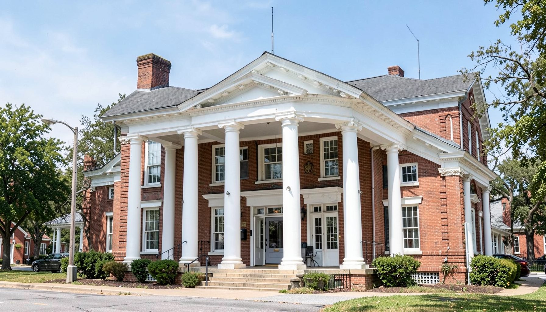 A historic courthouse building with white columns, small-town Georgia architecture.